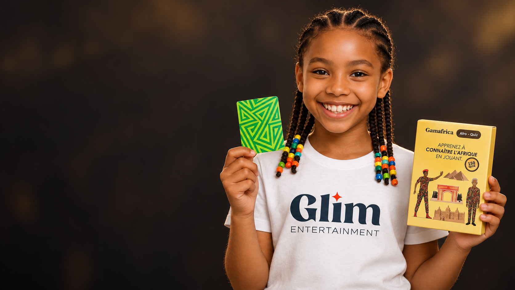 Child showing a Gamafrica Afrique card and game box